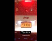 Car with yellow yea aigh license plate 