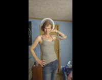 Woman pretends to be dinosaur with ring light