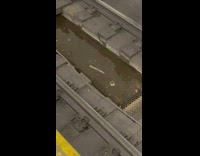 Knife in water on subway train track