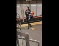 Woman hold creepy dolls wait for train