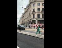 Girl wears red santa hat green leggings 