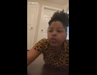 Leopard shirt girl whistles dog jumps face