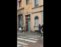Girl poses sidewalk brown trench coat guy 