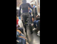 Guy wearing full body blue suit on subway train