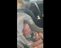 Dad say hi baby inside car smiles