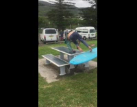 Guy blue surfboard picnic table fail 