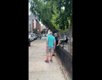 Man with Cockatoo on shoulder at street