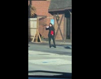 Woman takes selfie in front of random building 