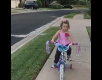 3 year old girl falls off  pink bike 