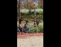 Woman brown checkered poncho throw leaves