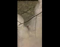 Guy snowman and girl snowman outside snowstorm 