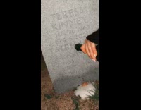 Little kid reacts to alcohol poured onto grave