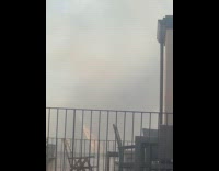 Large smoke from fire on building rooftop part 3