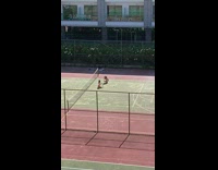 Girl poses for photos on empty tennis court