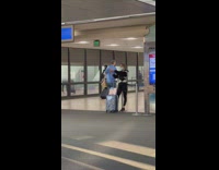 Woman with luggage selfie at the airport