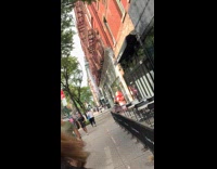 Collab WINY - Woman punch inflatable peanut decoration outside store