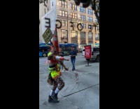 Traffic cone heads holding onto rope while walking