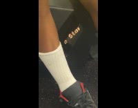 Train passenger bag on floor shows text