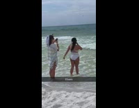 Girl poses on beach shore 