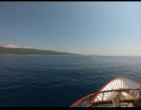 Ship Passes by Other Boats and Islands