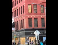 Machine on building window produce fake snow