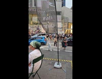 Woman tiktok sidewalk while filmer mocks her