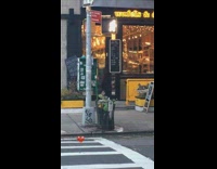 Person crossing street in heart costume