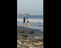 Boy lie down beach couple catch sunset