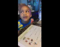 Little girl learns how to read and pronounces Who as Woah
