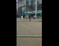 Girl yellow jacket dance outside public mall