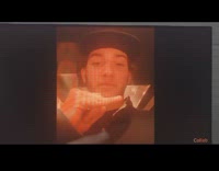 Man with bent little finger copies video