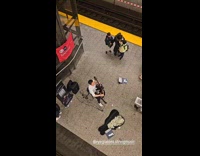 Crowd amused man playing cello on subway