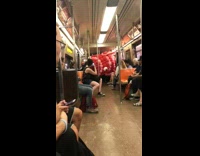 Giant red fish balloon on subway train
