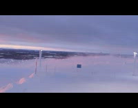 Windy Snowy Mountain top sunset cable car