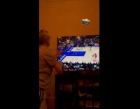 Dad takes photo of son on tv