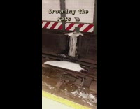 Soapy water floods train tracks in subway station drowning the rats