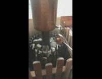 Red car pulls portable sauna down street 