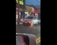 Car on fire parked at the street