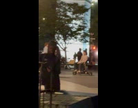 Man sit on chair on electric skateboard