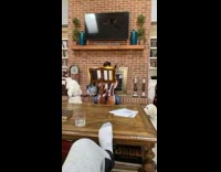 White dogs make noises while guy practice cello