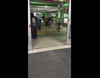 Two Women Dance at Airport for Video 