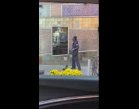 Guy enjoying and dancing life away with a broom