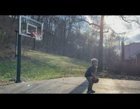 Kid Shoots Ball from Behind into Ring 