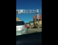 Guy rear ends silver car trains pass