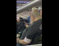 Guy sleeps at mets game 
