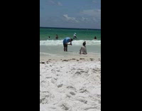 Lady poses sitting in shore 