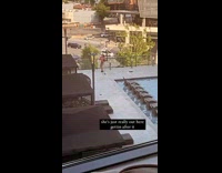 Collab IITW - Woman in pink crop top tiktok dance with tripod by the pool