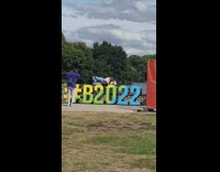 Woman lie down and raises leg on the signage