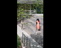 Woman pink robe walks for stairs video