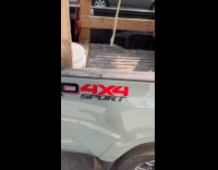 Feet on truck bed on the street